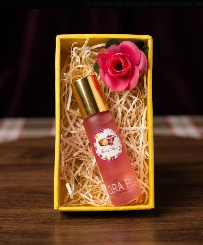 Pink Flora Pure Roll on in a yellow box with a pink rose on a wooden surface