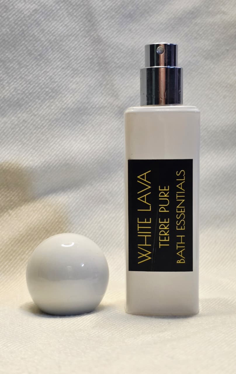 White bottle with black label on a textured gray background